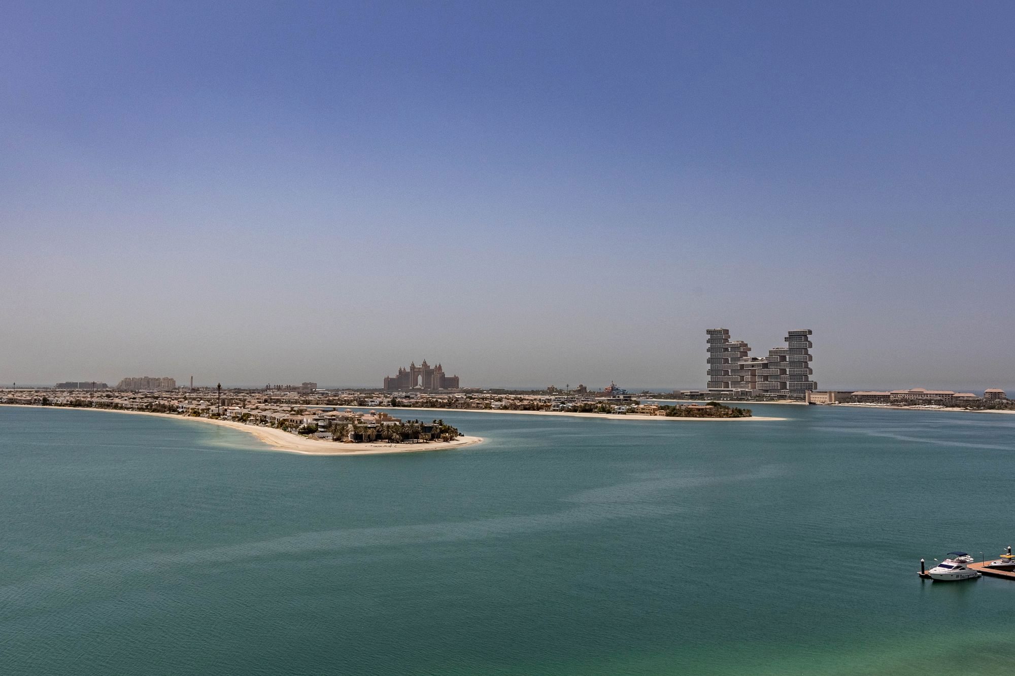 The palm-shaped Palm Jumeirah island and Dubai coastline from above
