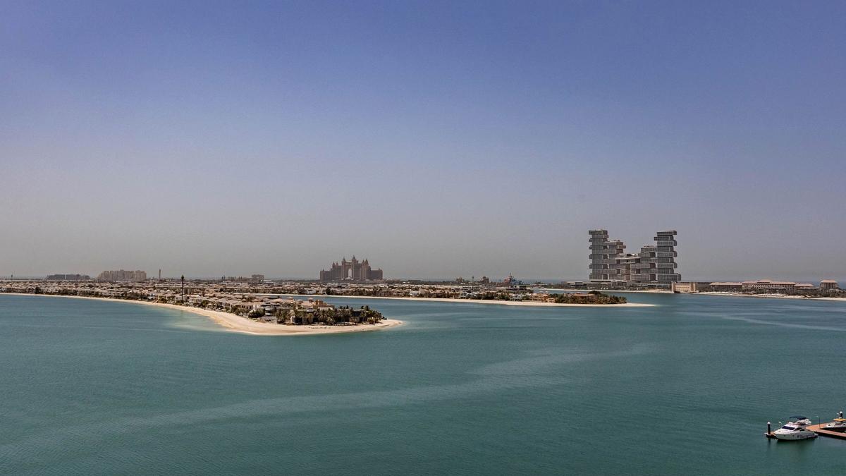 The palm-shaped Palm Jumeirah island and Dubai coastline from above