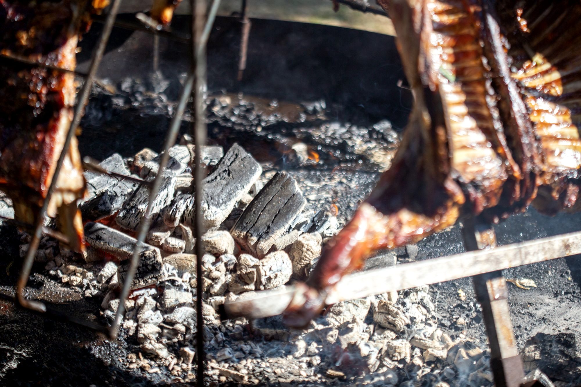 Grilled meat and vegetables over charcoal in the smoky Pasillo de Humo hall in Oaxaca