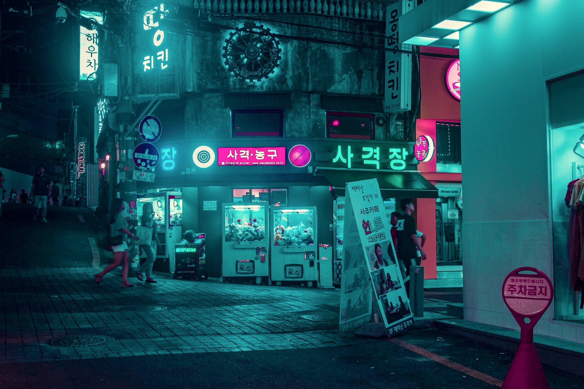 Crowded Myeongdong shopping street in Seoul lit up at night