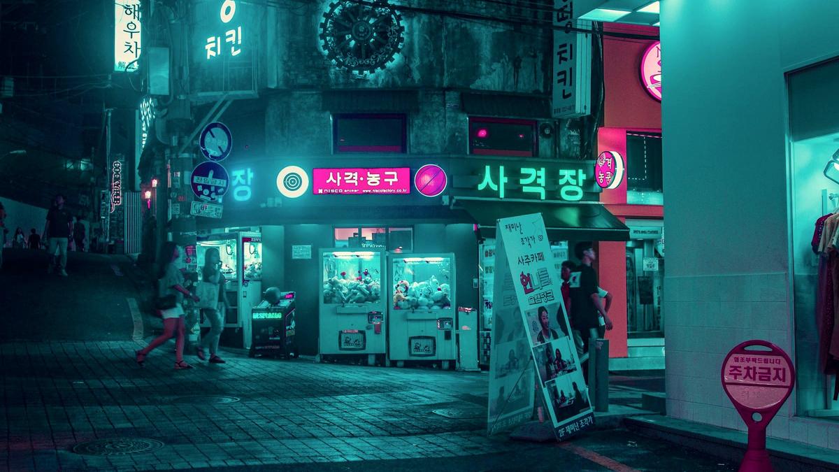 Crowded Myeongdong shopping street in Seoul lit up at night