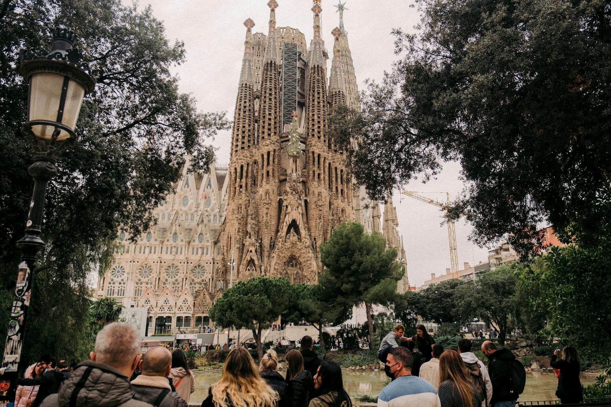 The intricate spires of the Sagrada Família rising against a clear morning sky