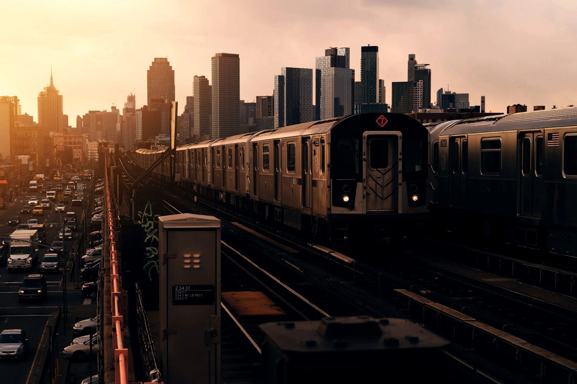 A New York City subway platform with an arriving train