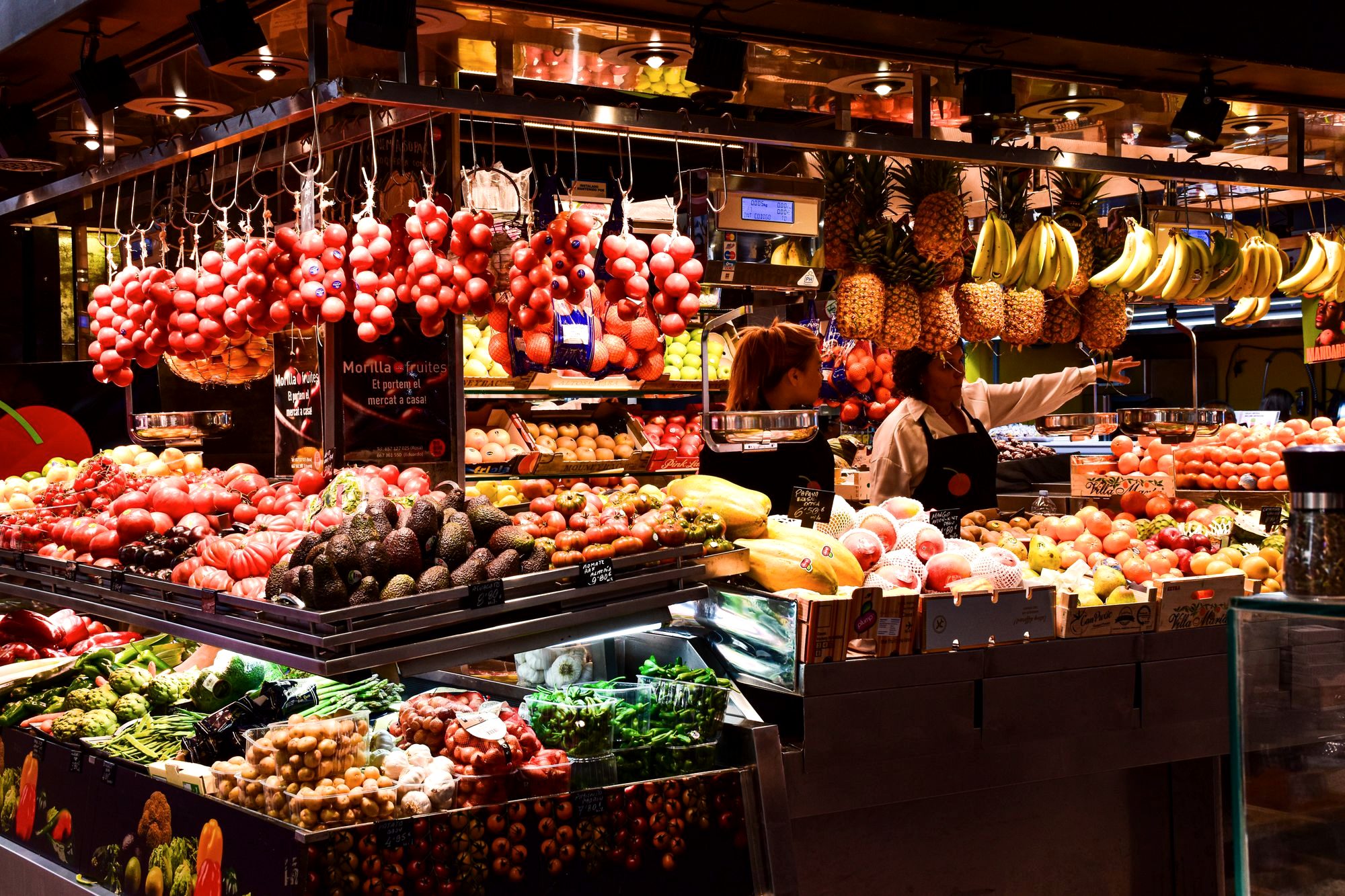 Colorful fruit and produce stalls inside Barcelona's La Boqueria market