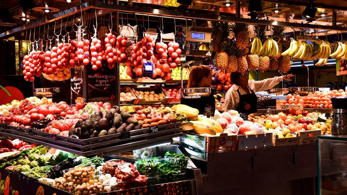 Colorful fruit and produce stalls inside Barcelona's La Boqueria market