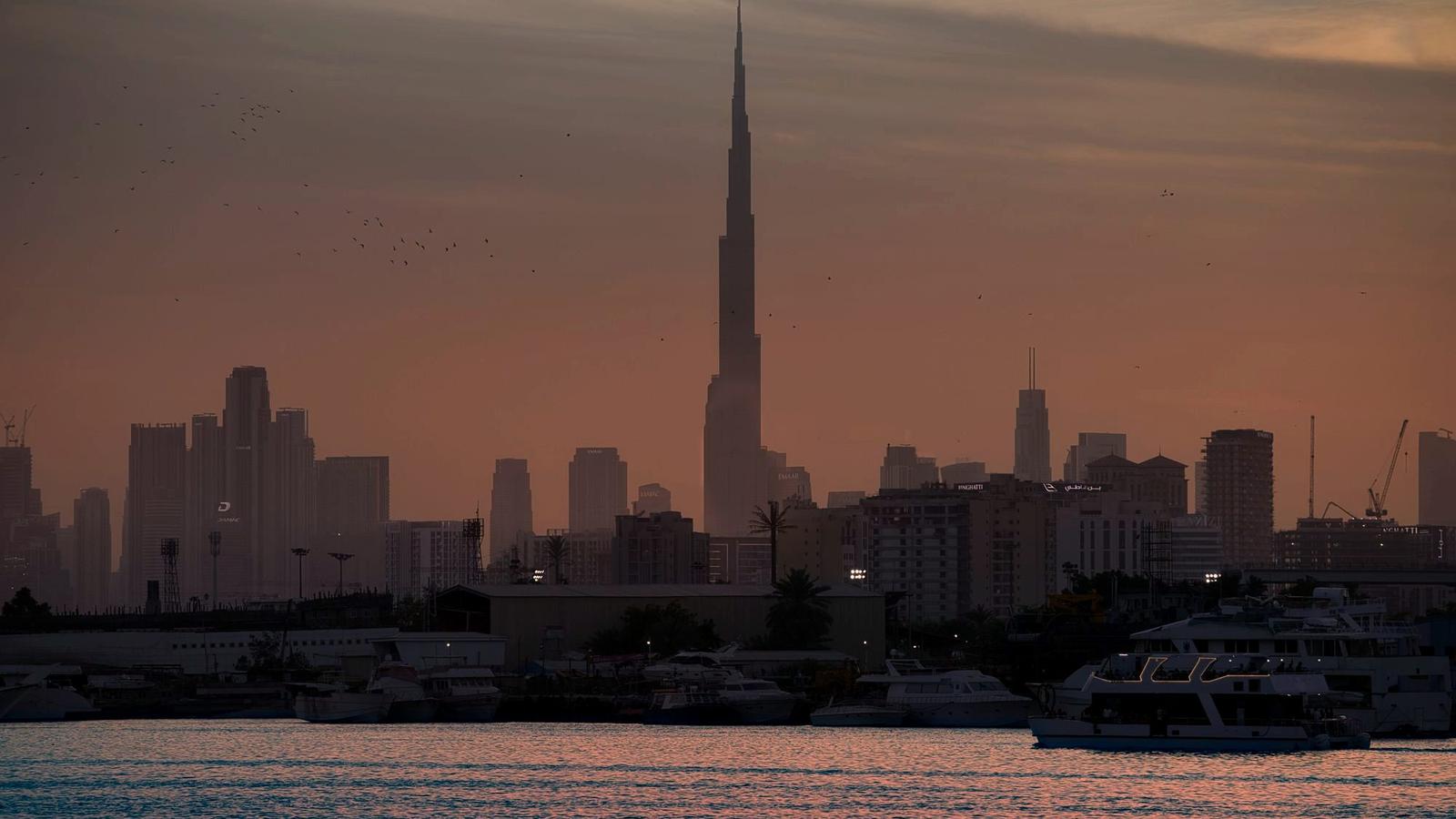The Dubai skyline with the Burj Khalifa rising over Downtown at dusk