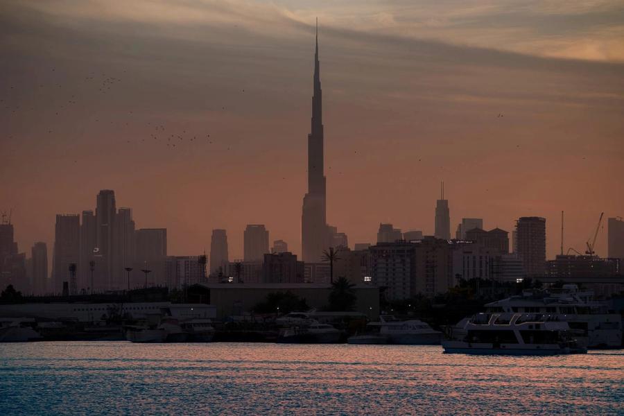 The Dubai skyline with the Burj Khalifa rising over Downtown at dusk