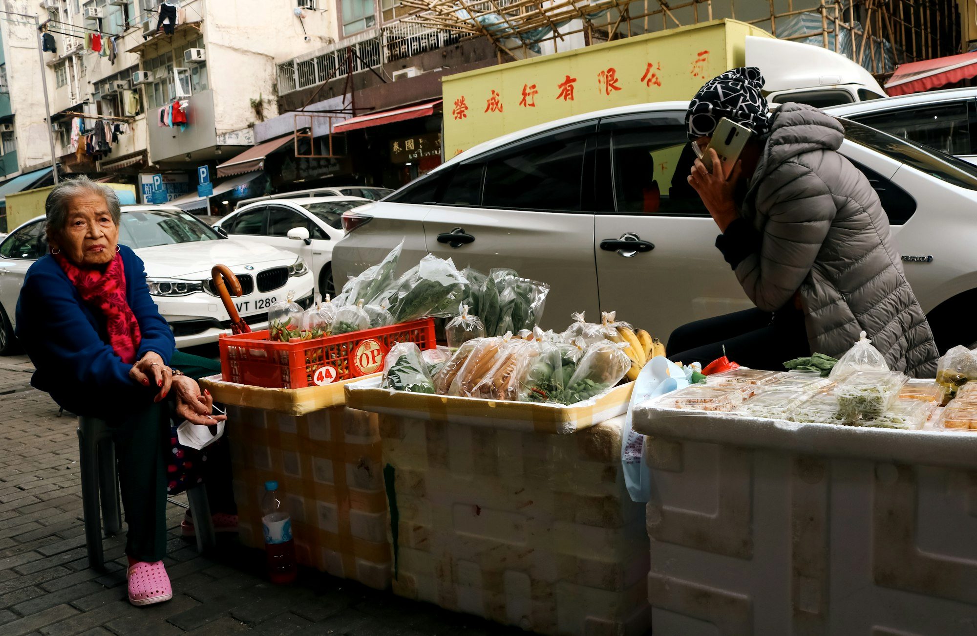 A local vendor at a small market stall in an underrated city