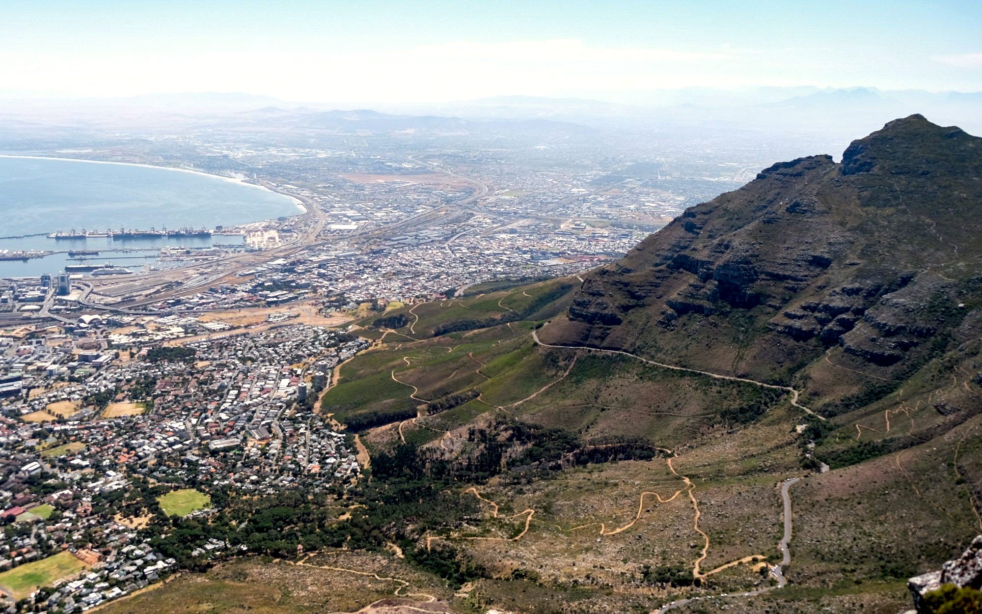 Table Mountain rising above the city and coastline of Cape Town