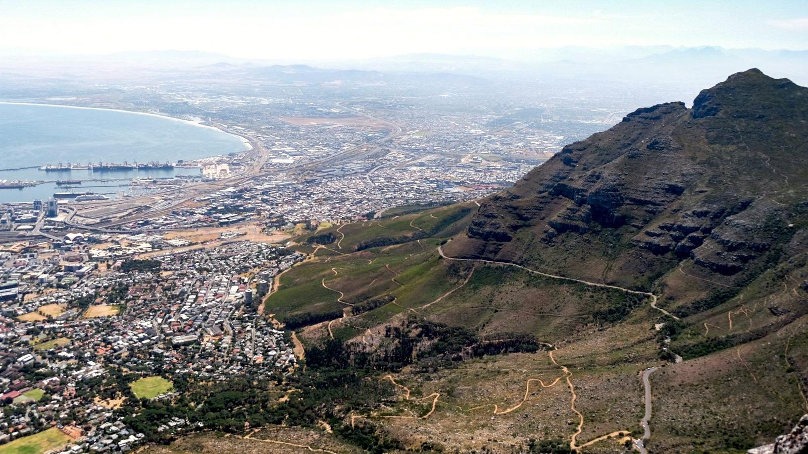 Table Mountain rising above the city and coastline of Cape Town