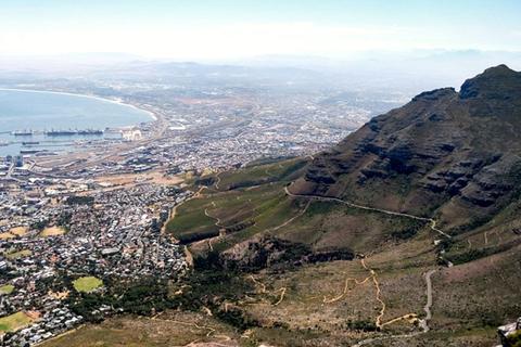 Table Mountain rising above the city and coastline of Cape Town