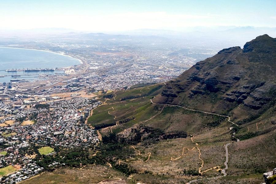 Table Mountain rising above the city and coastline of Cape Town