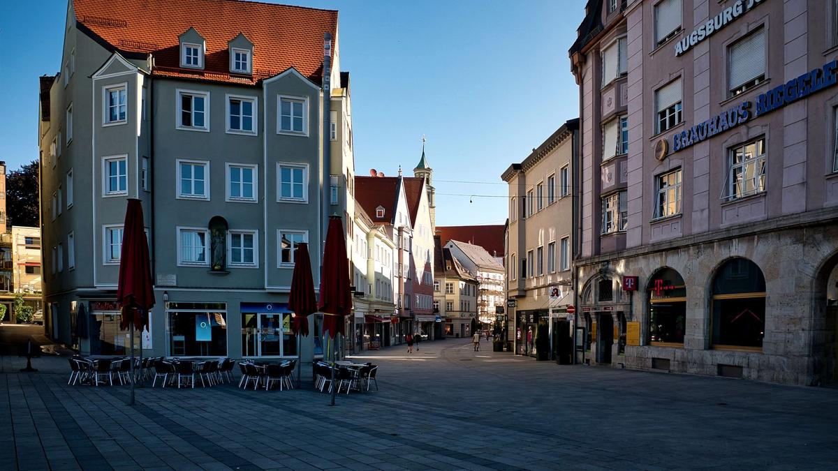 A calm cobblestone square in an underrated European old town at morning