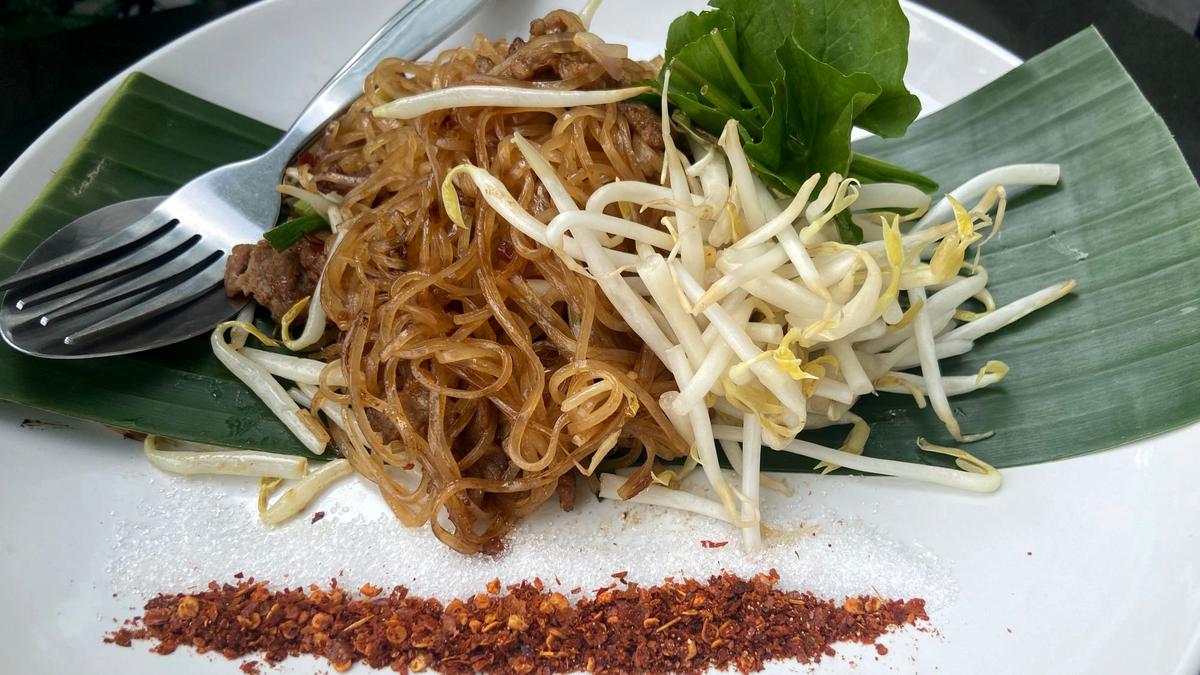 Small bowls of dark-broth boat noodles at a Victory Monument stall in Bangkok