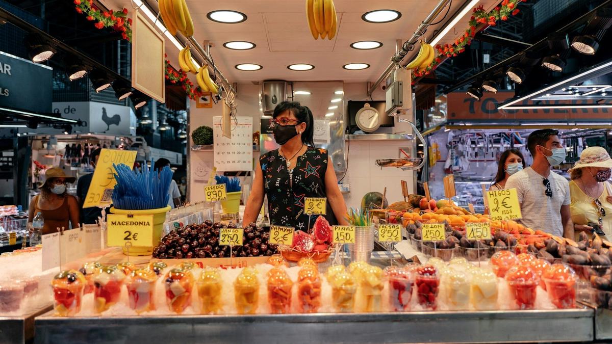 Colorful fruit and produce stalls inside Barcelona's La Boqueria market