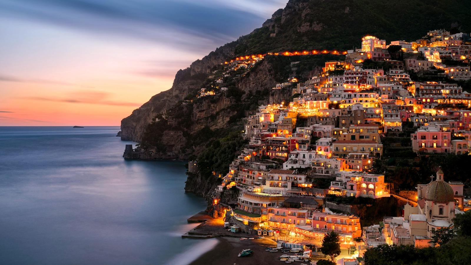 Positano's pastel houses stacked above the sea on the Amalfi Coast