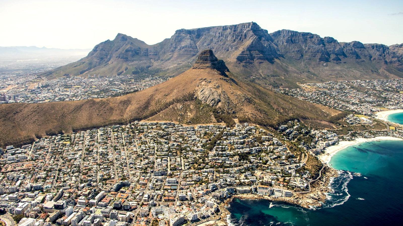 Table Mountain rising above the city and coastline of Cape Town