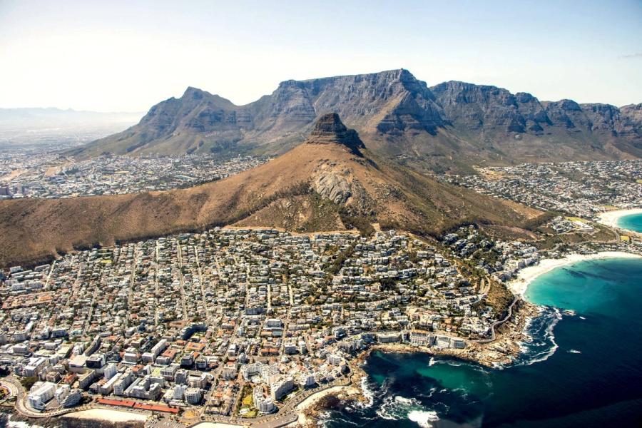 Table Mountain rising above the city and coastline of Cape Town
