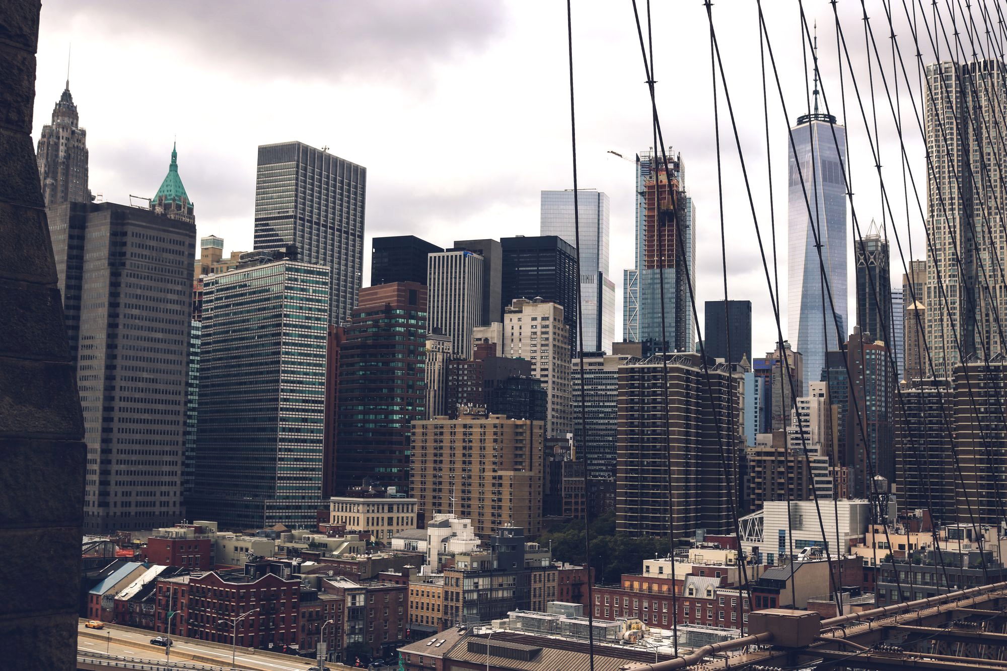 The Brooklyn Bridge and the Manhattan skyline at dusk