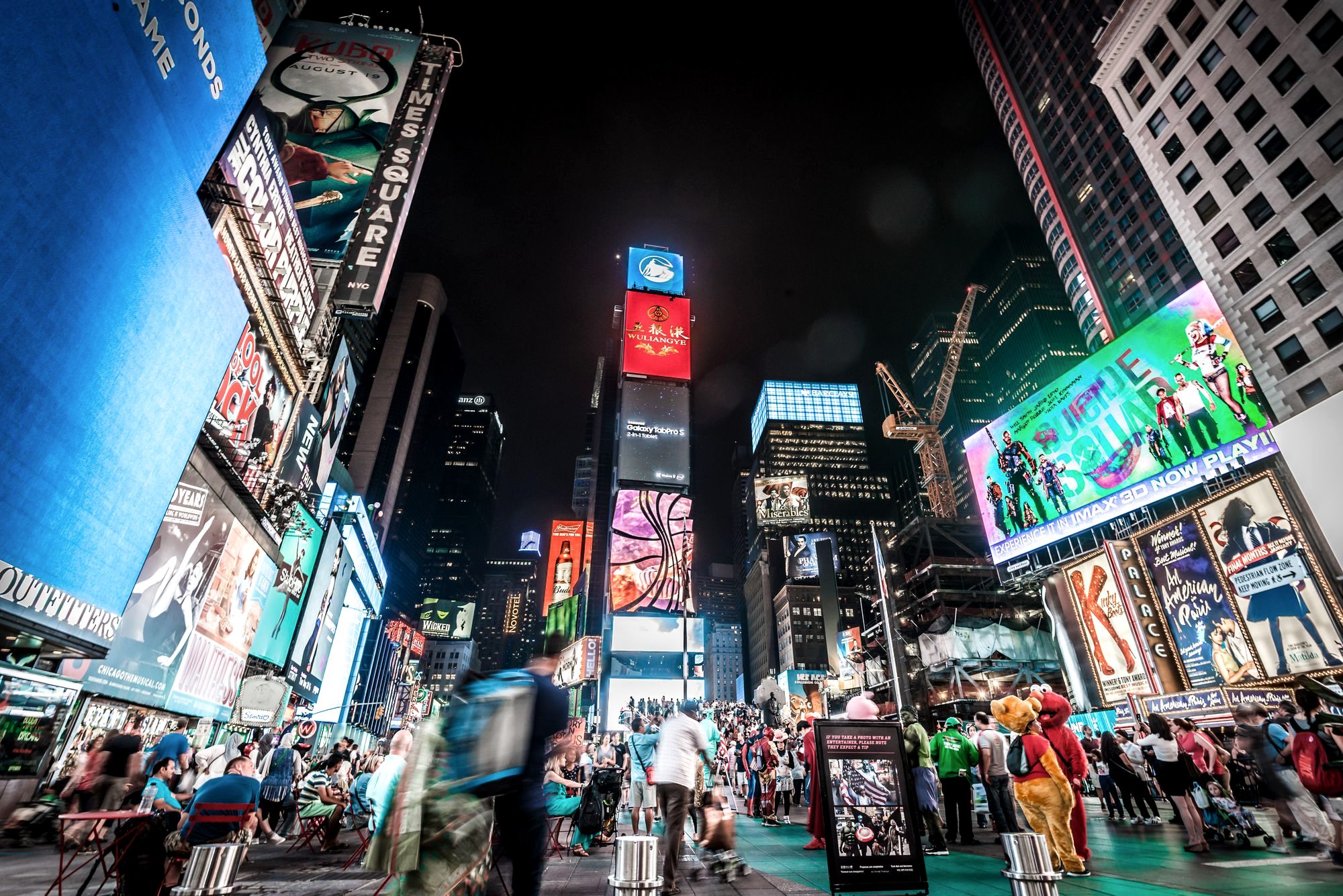 The crowded, billboard-lit chaos of Times Square in New York City at night