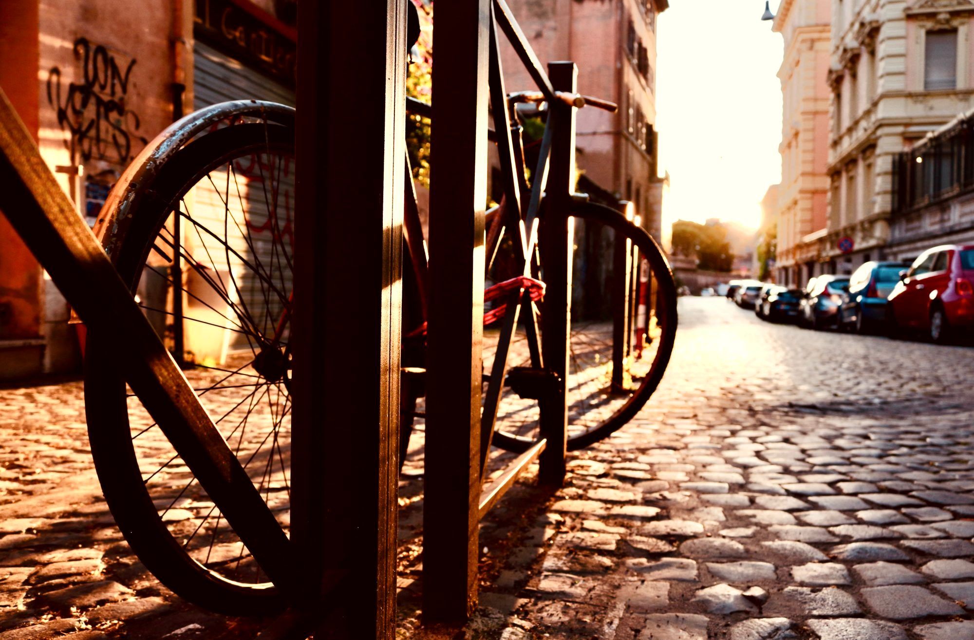 A quiet Rome side street paved with black basalt sampietrini cobblestones