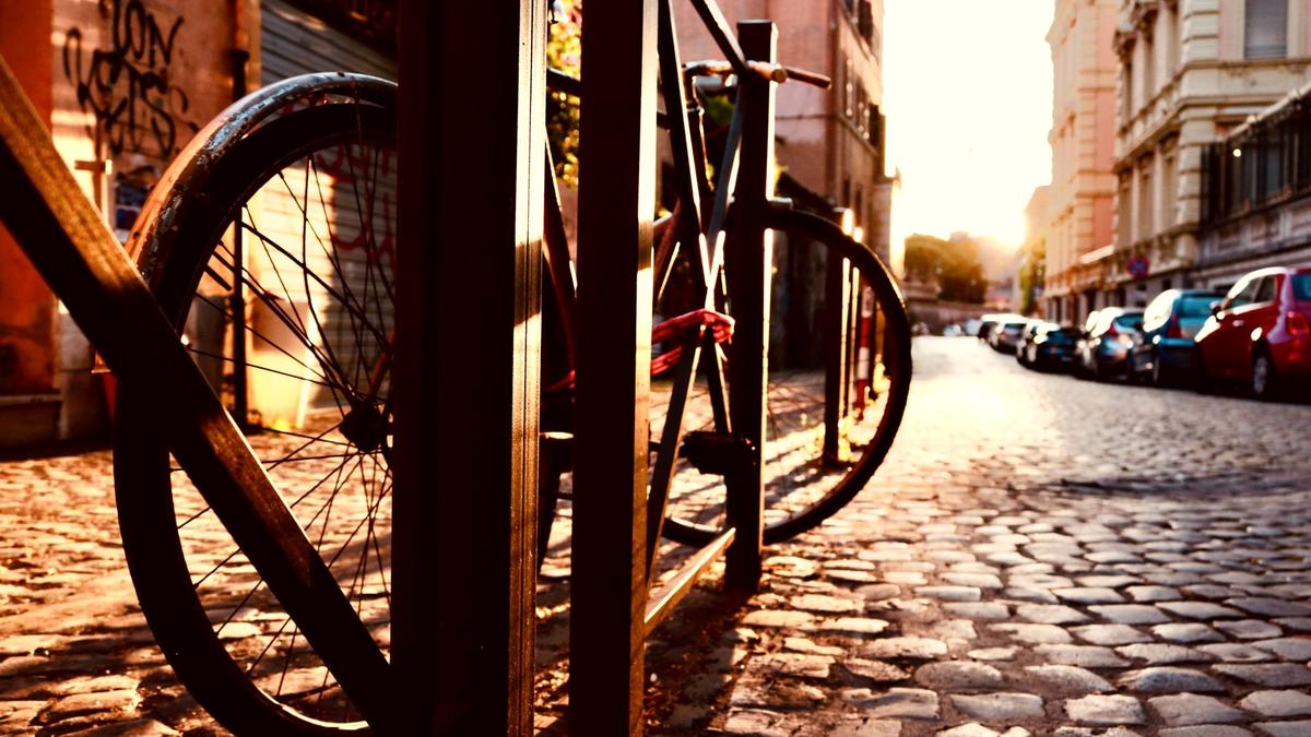 A quiet Rome side street paved with black basalt sampietrini cobblestones