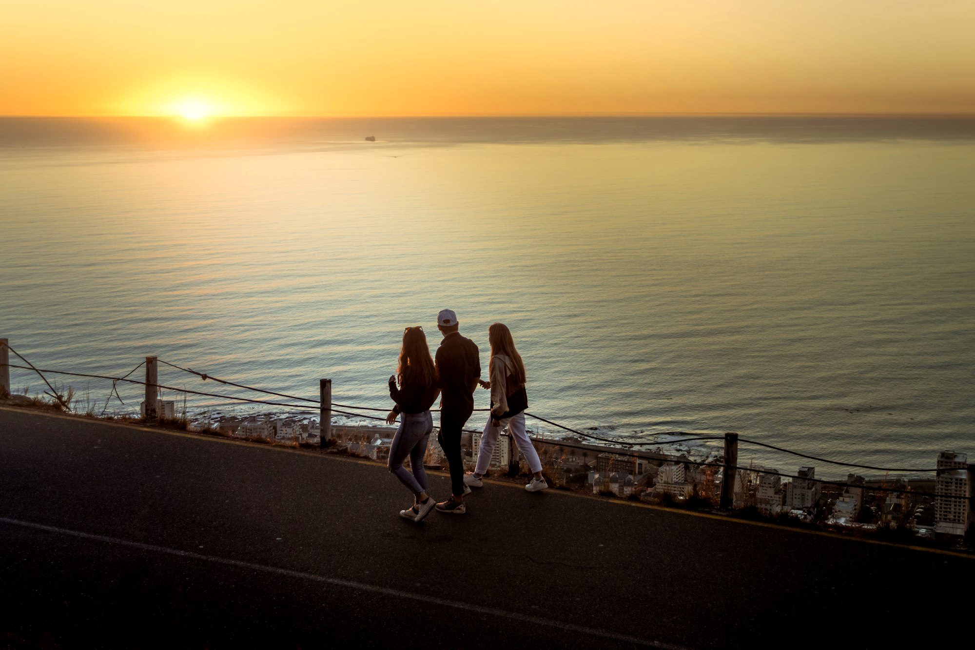 Sunset over the Atlantic and the city lights seen from Signal Hill in Cape Town