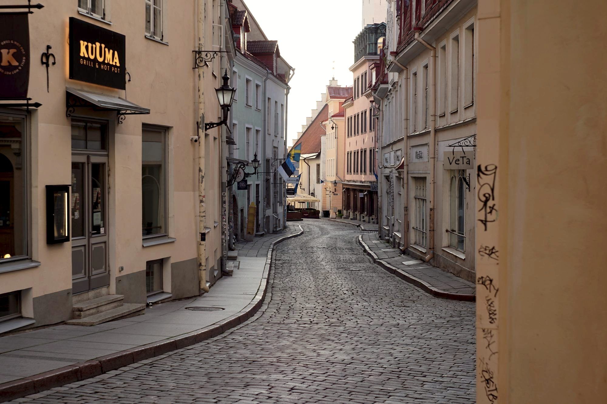 A quiet cobblestone street in an underrated old-town city with no crowds