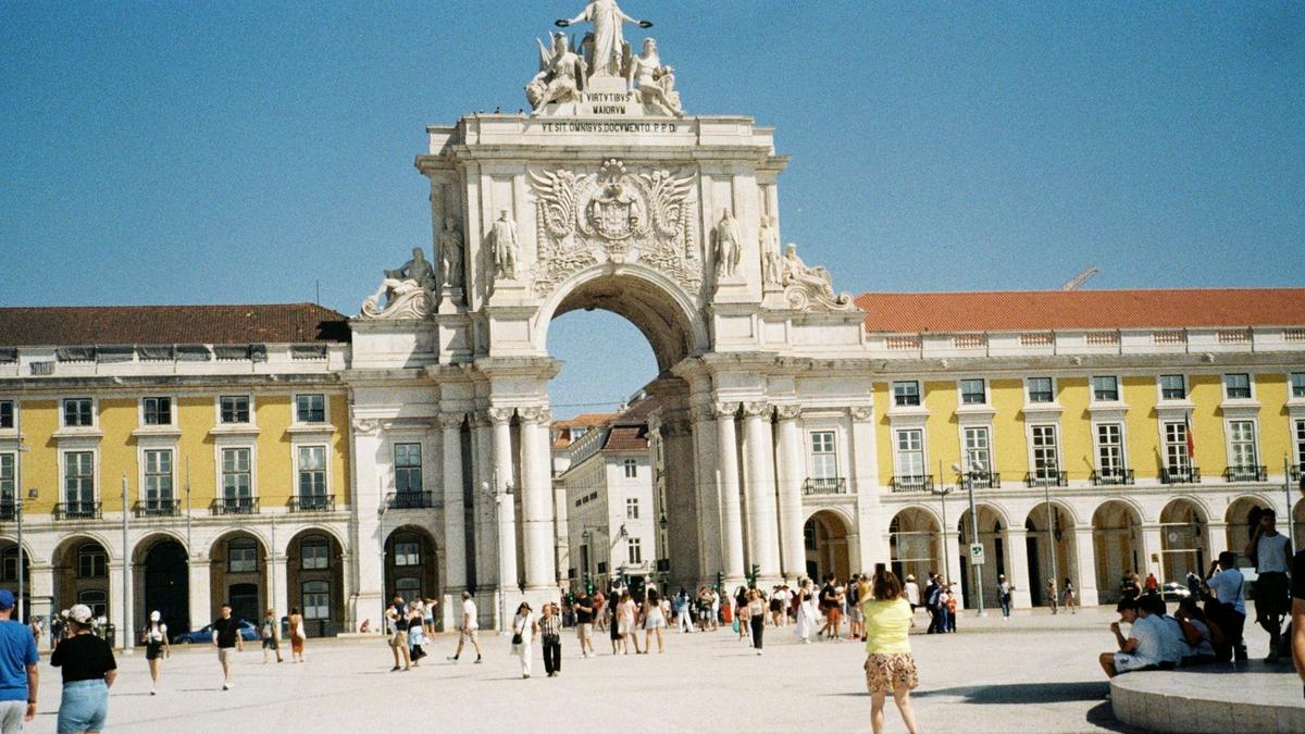 Praça do Comércio, Lisbon's grand riverside square, framed by yellow arcaded buildings