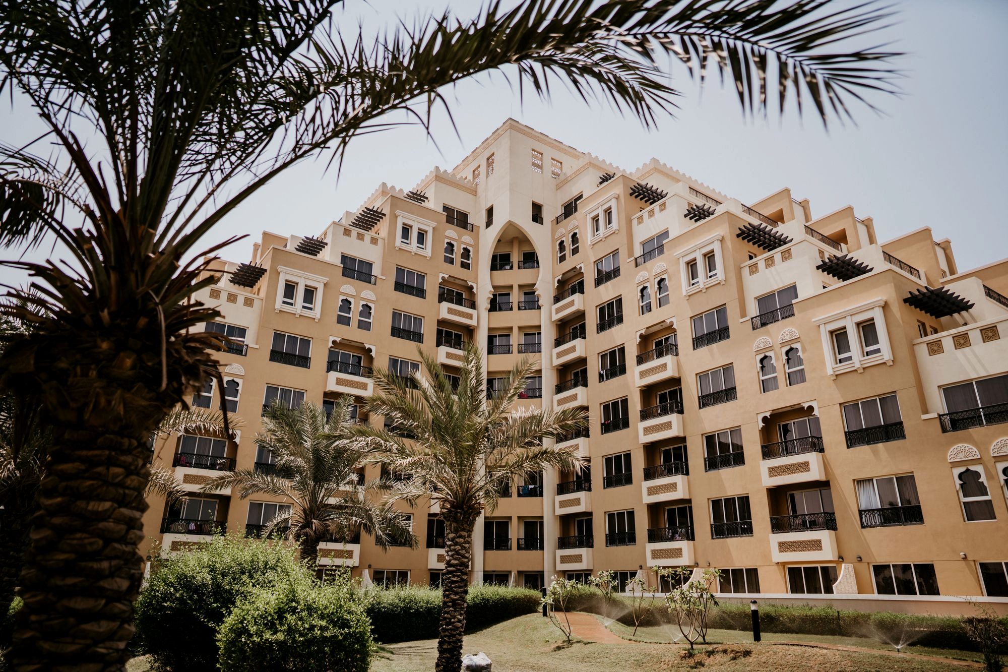 A modern mid-range hotel with a pool in Dubai