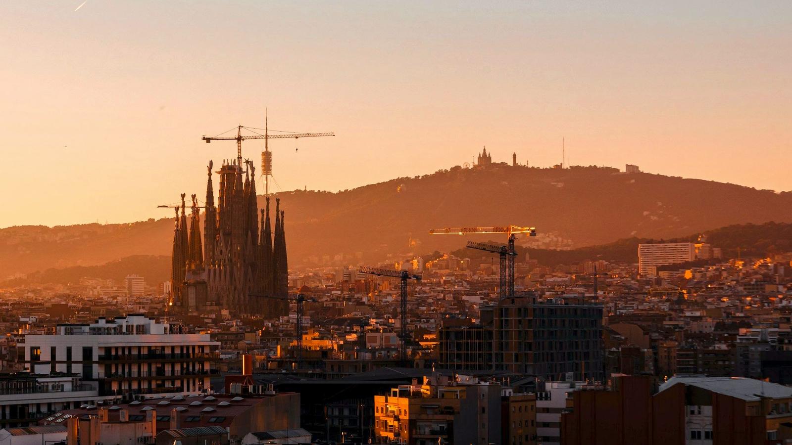The Sagrada Família basilica towering over Barcelona at golden hour