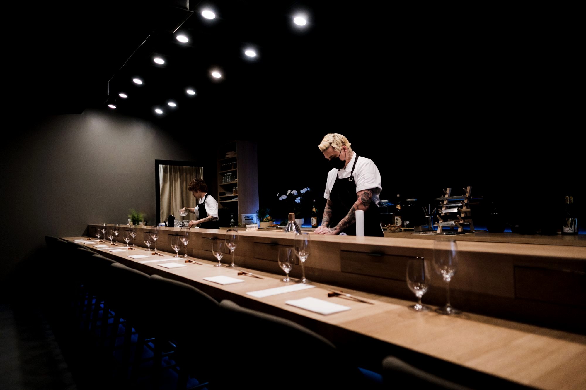 A sushi chef preparing otoro behind an upscale omakase counter in Ginza, Tokyo