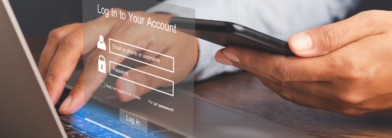 Hands typing on a laptop with a holographic login screen overlay