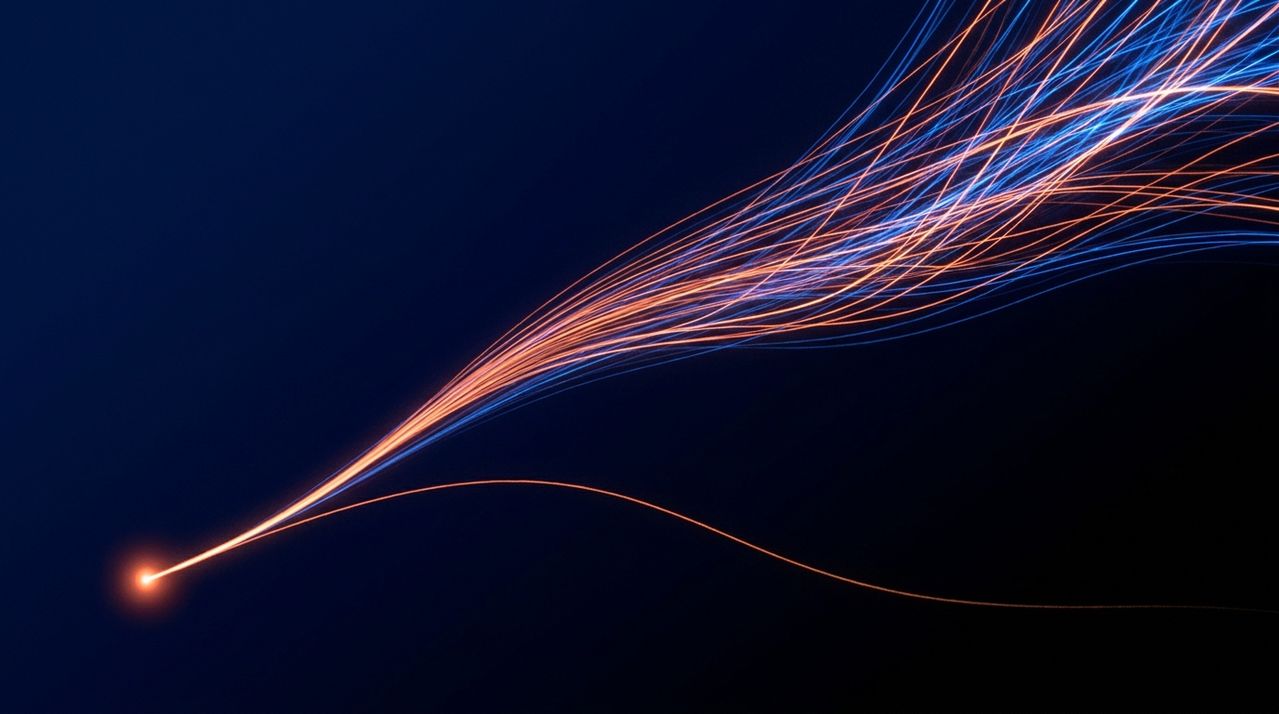 Abstract long-exposure light trails on a deep navy field: a single orange thread fades into darkness while a second path branches and multiplies into many ascending orange and electric-blue filaments — AI as a multiplier, not a reducer.