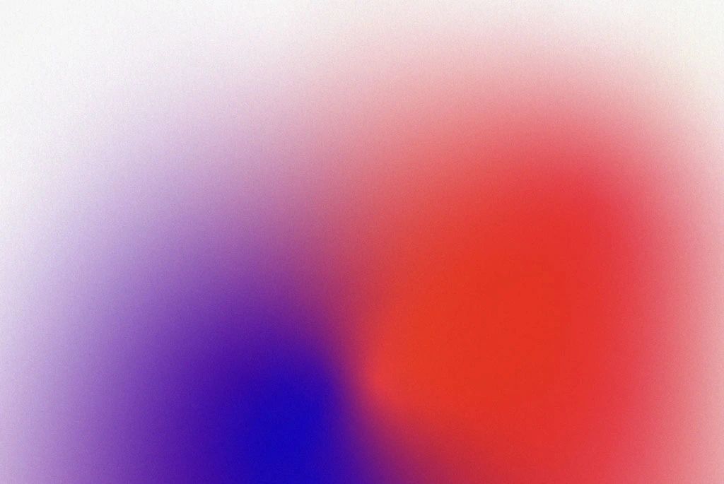 Soft gradient blur of purple, red, and blue tones on a white background