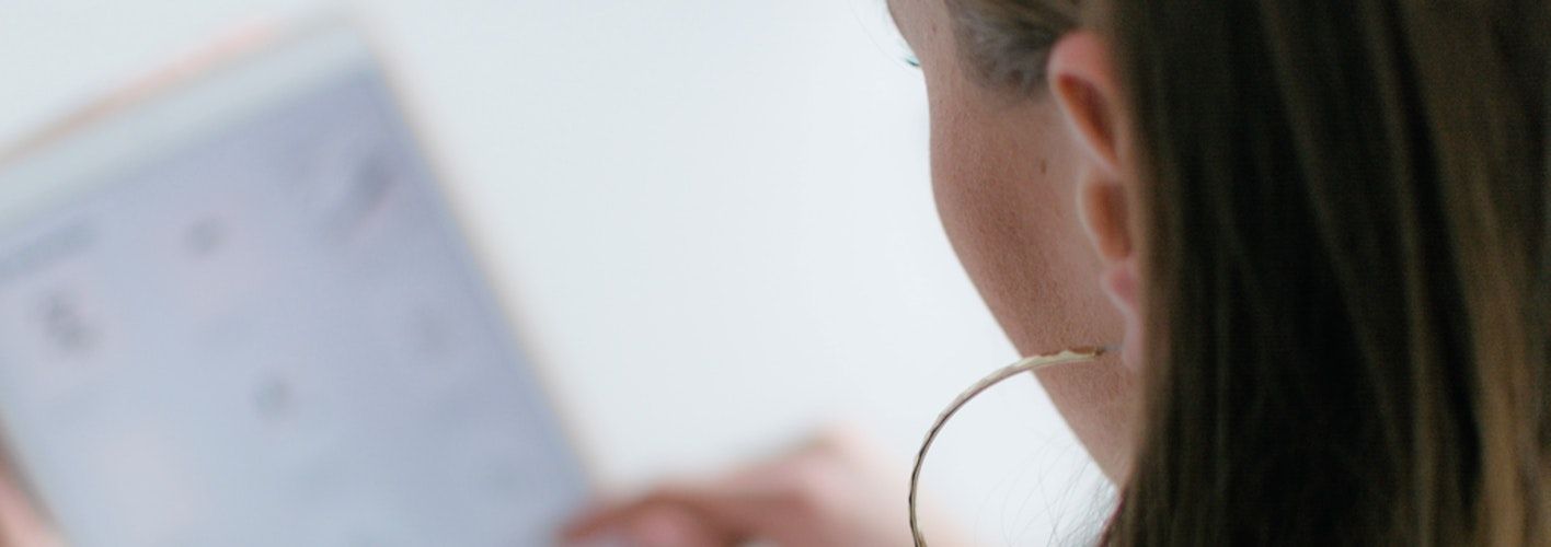 Woman browsing a healthcare website on a tablet