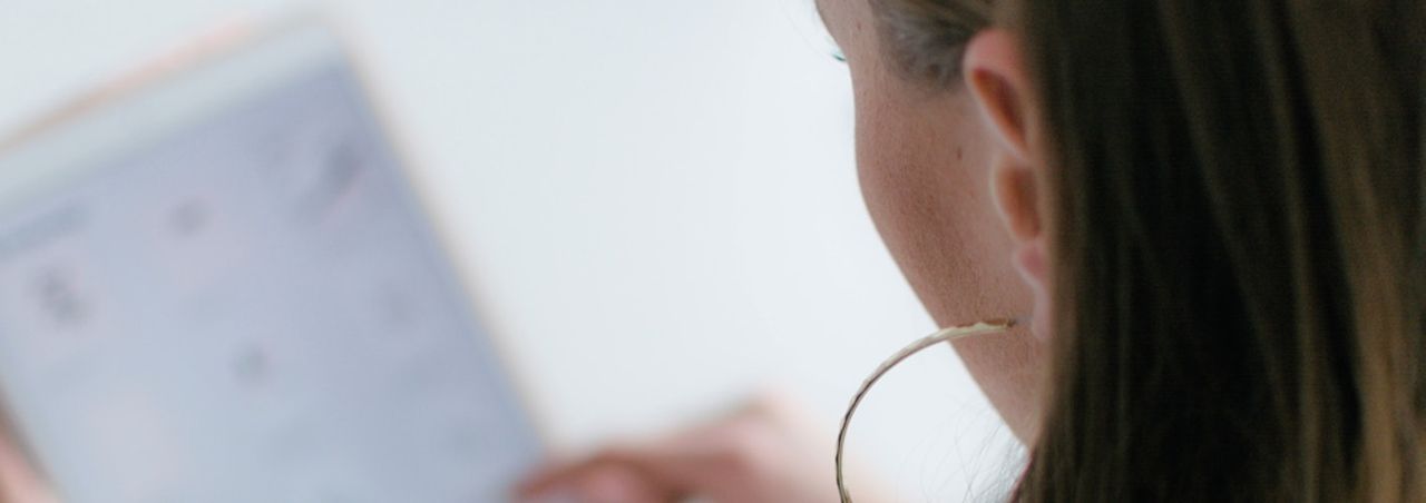 Woman browsing a healthcare website on a tablet