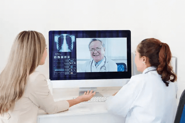 Patient and healthcare provider on a telehealth video call with X-ray images on screen