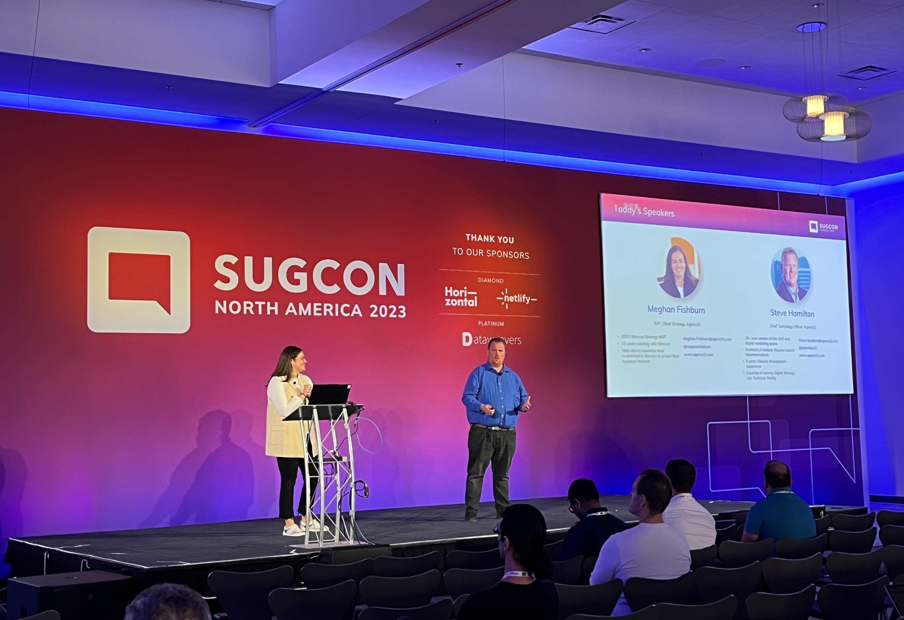 Two presenters on stage at SUGCON North America 2023 conference