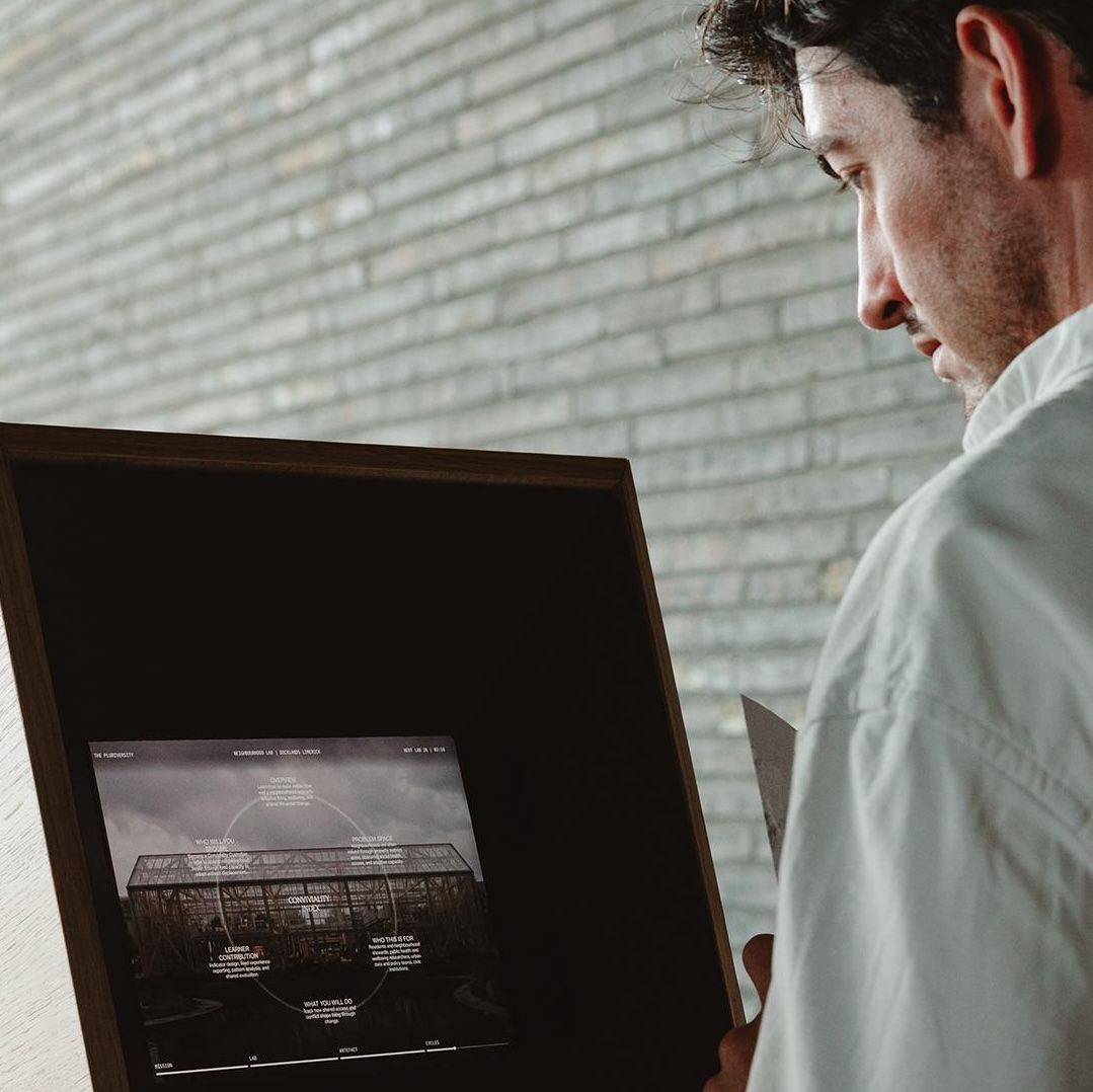 A man interacts with a digital story sequence at an exhibition