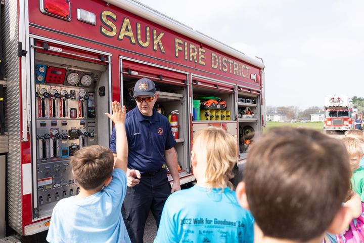 Gabe Ledesma (1) asks a question about Sauk's fire truck.