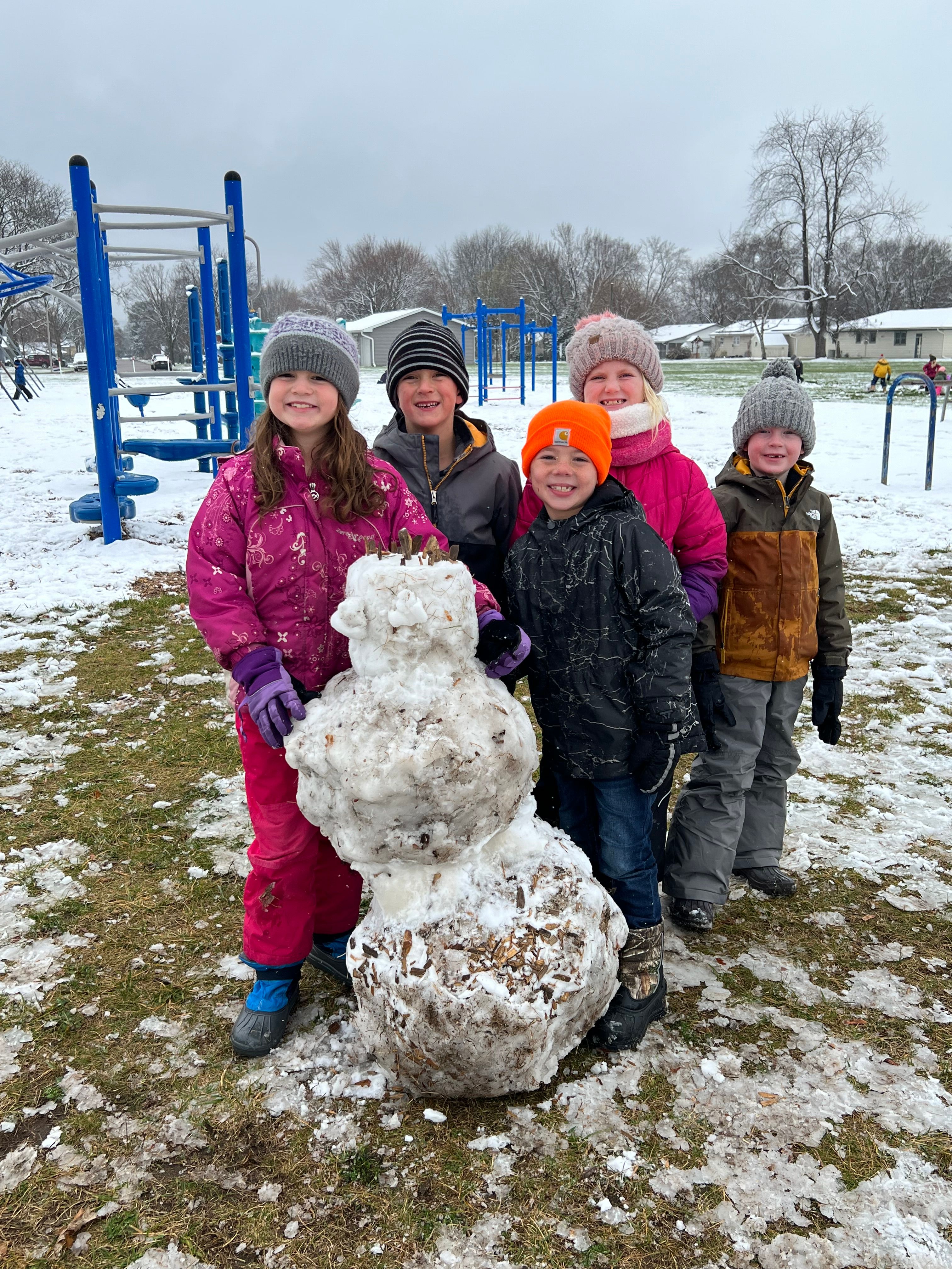 2nd graders Rosie Moss, Camden Dischler, Madden Dischler, Kyra Muller and Francis Rossing show pride in their newly-constructed snowman! One of the joys of being a kid!