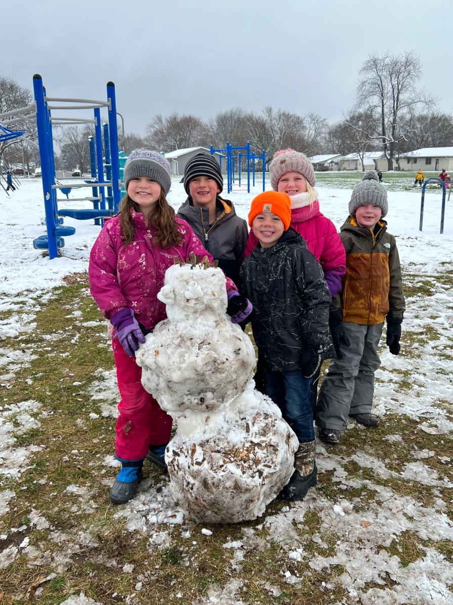 2nd graders Rosie Moss, Camden Dischler, Madden Dischler, Kyra Muller and Francis Rossing show pride in their newly-constructed snowman! One of the joys of being a kid!