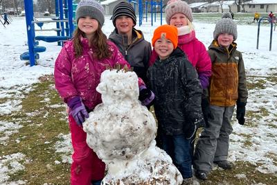 2nd graders Rosie Moss, Camden Dischler, Madden Dischler, Kyra Muller and Francis Rossing show pride in their newly-constructed snowman! One of the joys of being a kid!