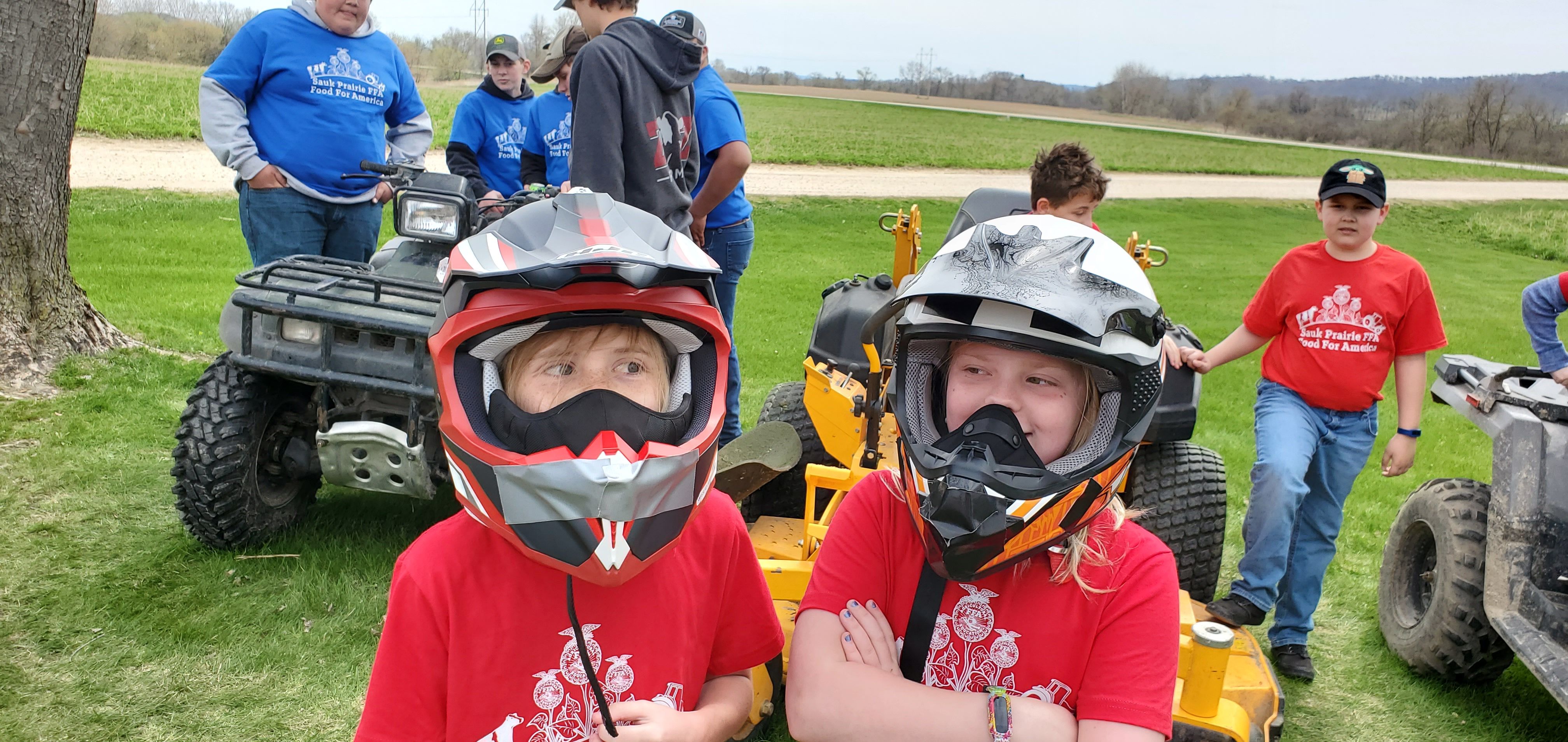 Brynn Dischler and Rhylan Muller test out some ATV helmets.