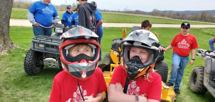 Brynn Dischler and Rhylan Muller test out some ATV helmets.