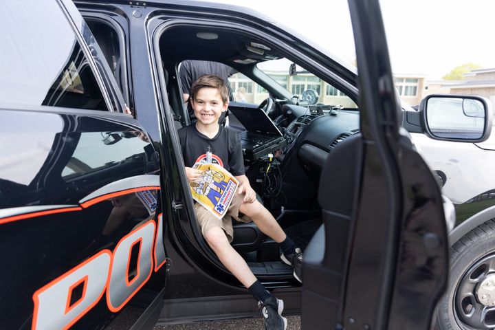 Brady Dent (1) enjoys his first (and hopefully last) time sitting in a police car ;-)
