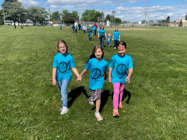 2nd grade classmates and friends, Scarlet Sauter, Reegan Ederer and Adalynn Kasper (all grade 2) enjoy the walk-a-thon hand in hand.