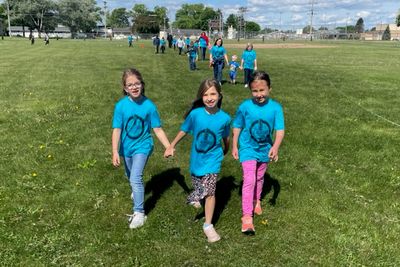 2nd grade classmates and friends, Scarlet Sauter, Reegan Ederer and Adalynn Kasper (all grade 2) enjoy the walk-a-thon hand in hand.