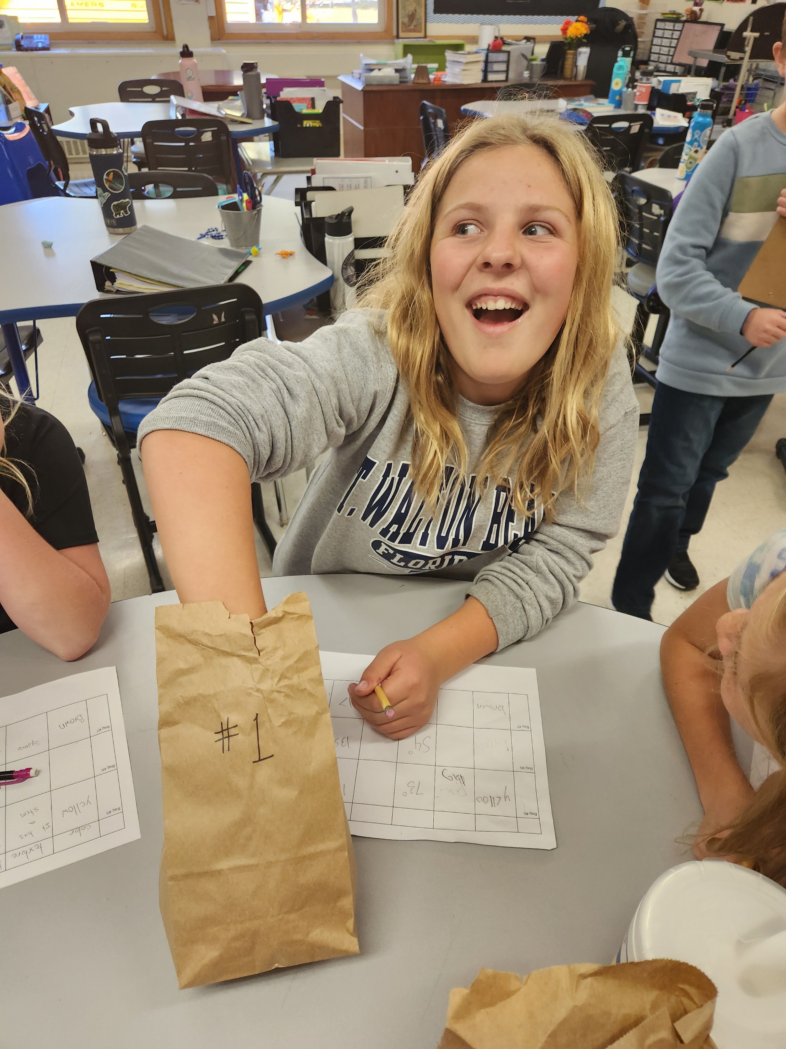 Meg Brickl (5) digs into her "mystery bag" to figure out what's inside.